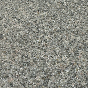 A glossy, textured surface composed of small, tightly packed grey, tan, and white pebbles or stone chips embedded in a clear resin.